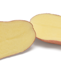 Alouette biologische aardappel doorgesneden, toont gele binnenkant met rode schil, verse kwaliteit pootaardappel